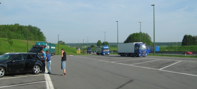 a large car park, empty save for a few cars and lorries